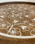 rustic wood riser with white flowered design