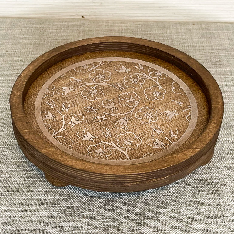 rustic wood riser with white flowered design