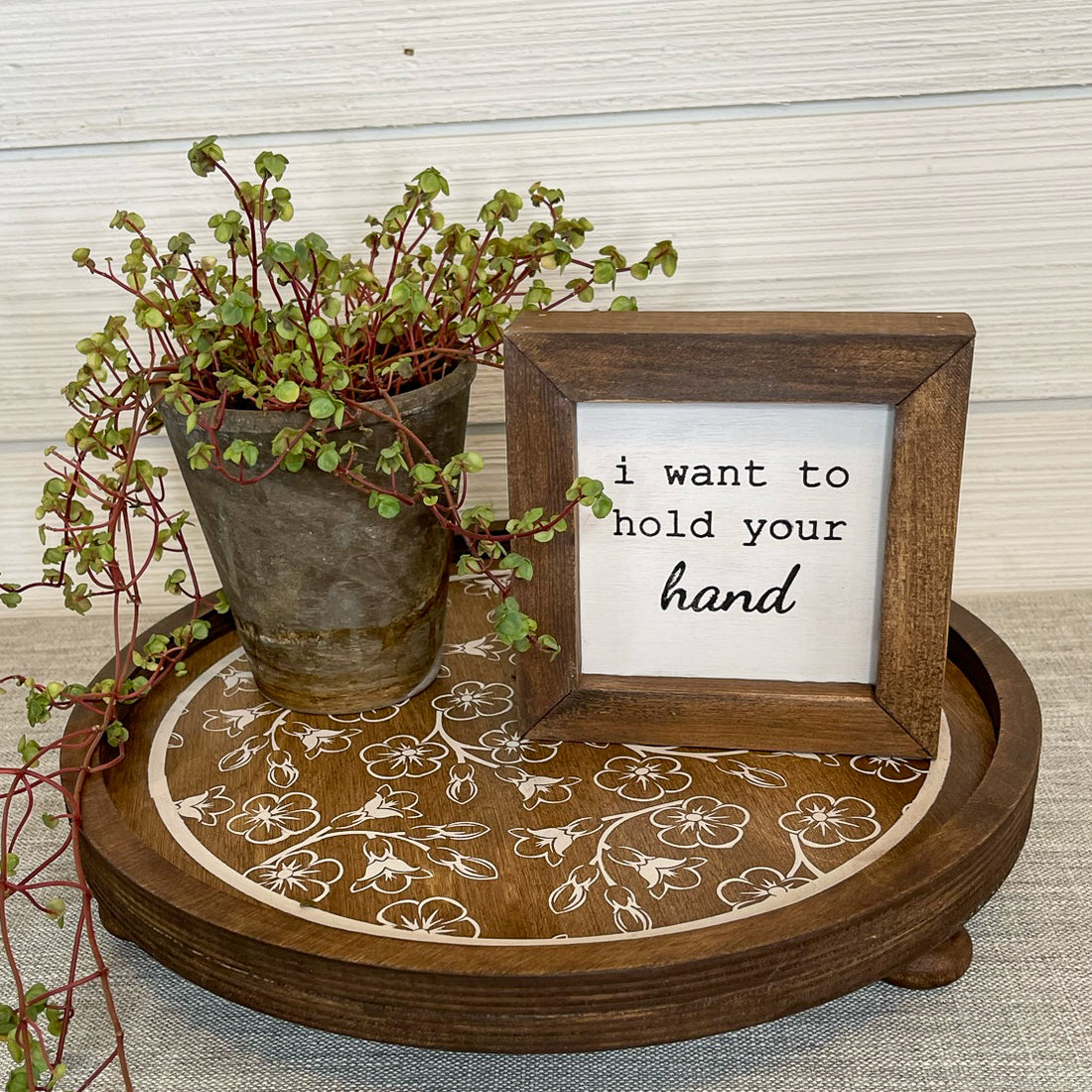 rustic wood riser with white flowered design