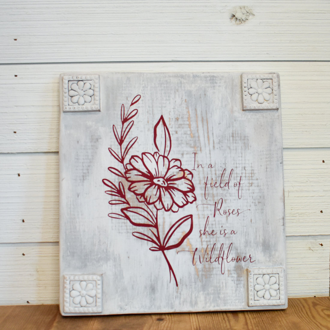 in a field of roses she's a wild flower