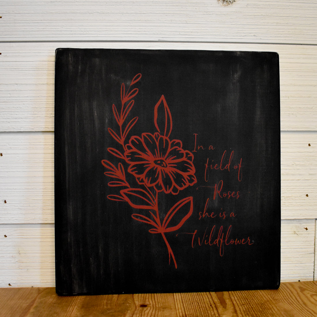 in a field of roses she's a wild flower