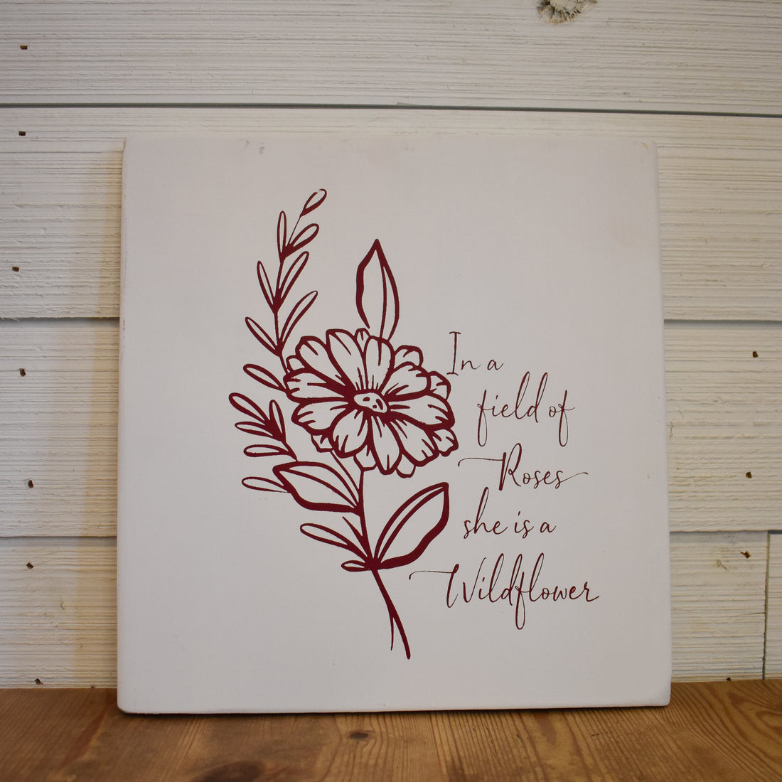 in a field of roses she's a wild flower