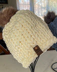 chunky knitted beanie hat with pom-pom