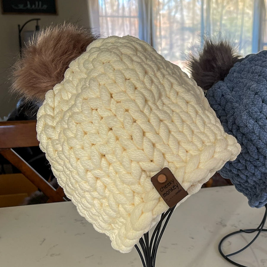chunky knitted beanie hat with pom-pom