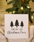 fresh cut christmas trees in white