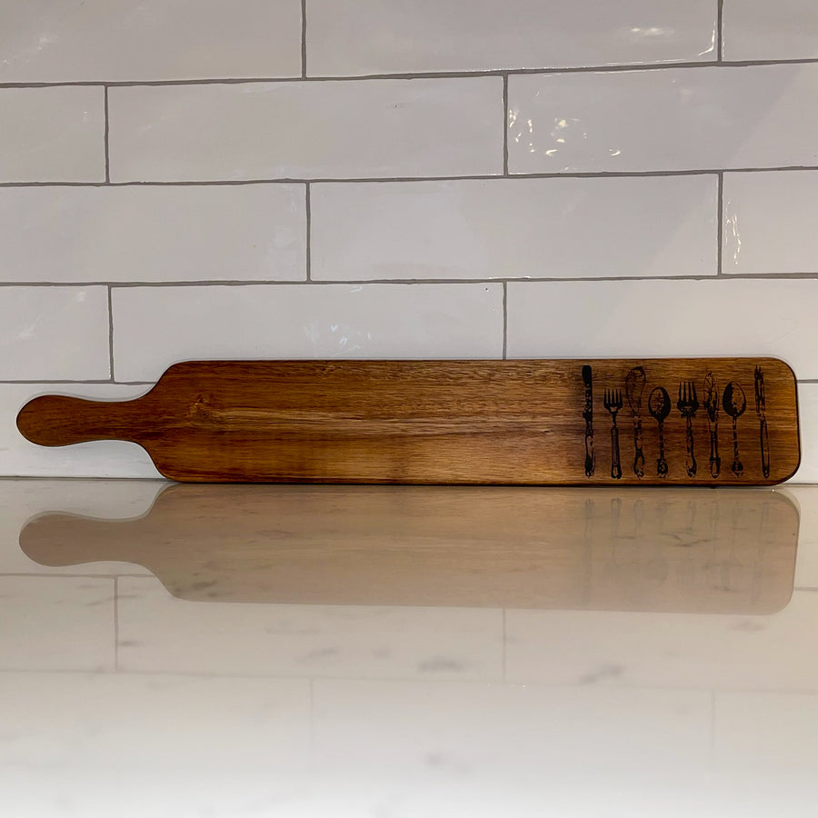 cutting board: wood-burned | cutlery