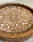 rustic wood riser with white flowered design