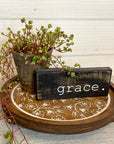 rustic wood riser with white flowered design