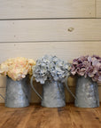 galvanized metal jug with patina finish